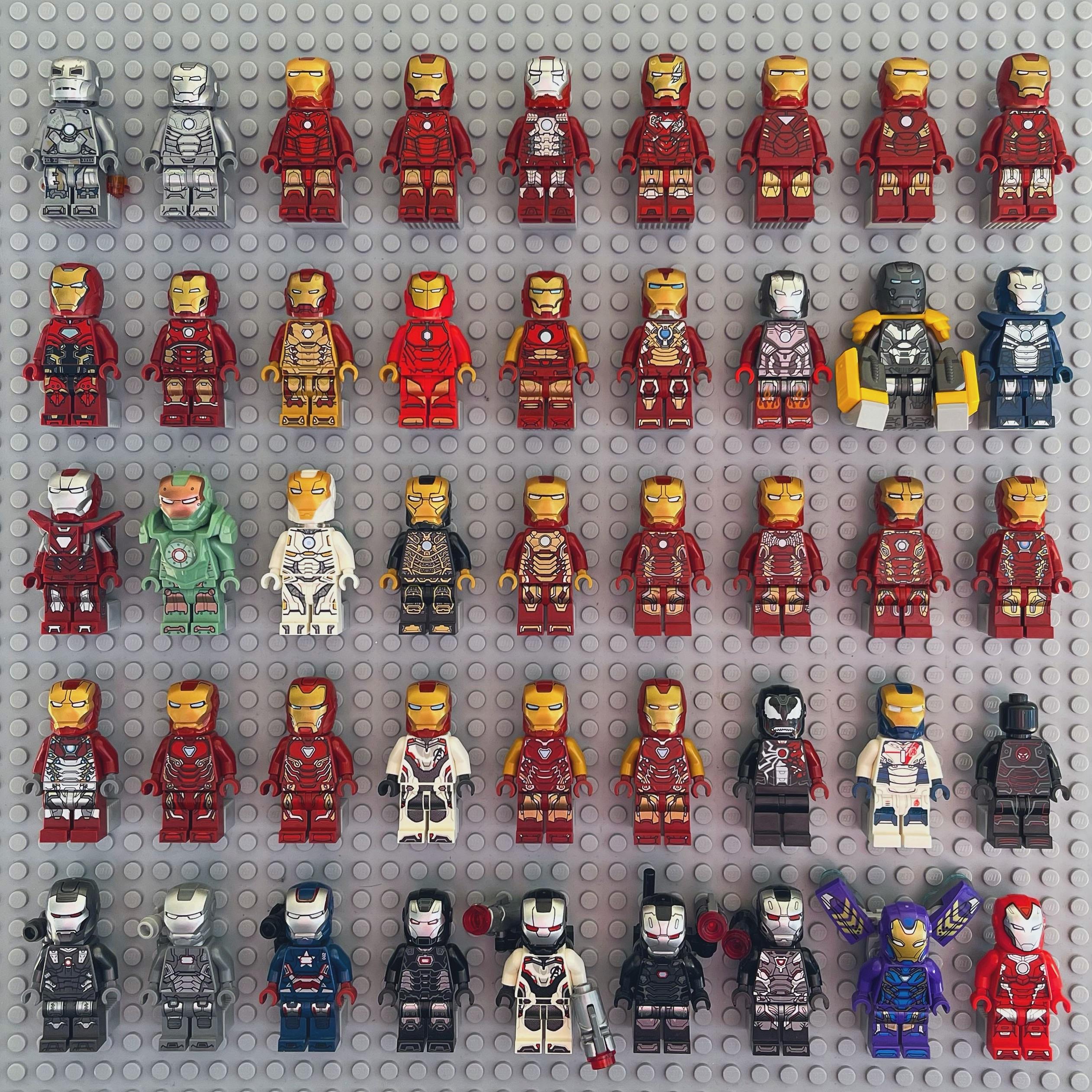 A custom LEGO Hall of Armor display showing over twenty Iron Man minifigure suits including the Mark 1 and Silver Centurion.