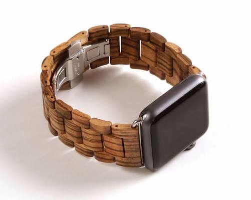 Premium walnut wooden watch strap installed on an Apple Watch showing natural grain details