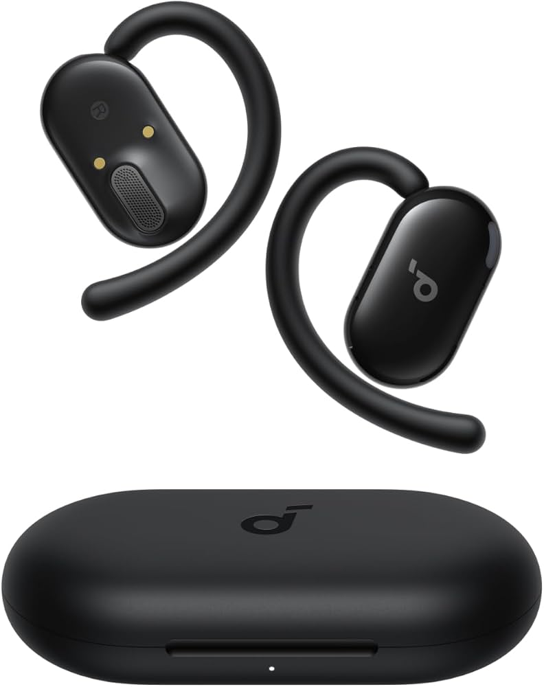 Anker Soundcore open charging case displaying the left and right ergonomic wireless earbuds alongside alternative silicone tips on a clean studio workspace layout.