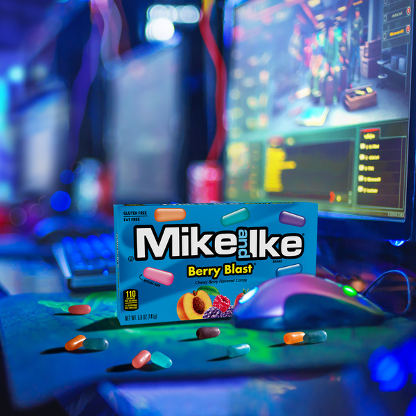 Close up view of individual Mike and Ike Berry Blast chewy candy pieces showing outer glaze