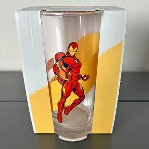 Clear drinking glass featuring a graphic of Marvel's Iron Man in red and gold armor with glowing repulsor blasts
